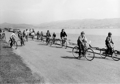 Families cycling on the east side of Cumbrae.