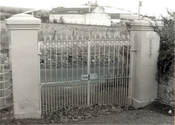 Gates of the Kirkton Graveyard leading onto Golf Road. Note the jouges on the right pillar - originally they would have been attached to the church wall and used to punish offenders by humiliation.