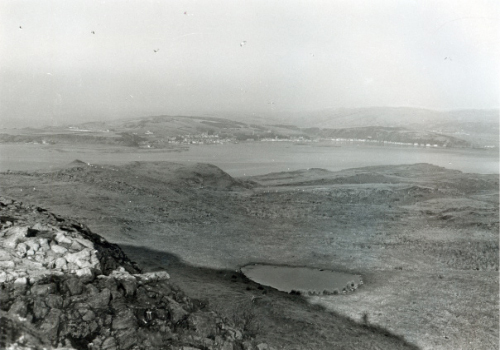 Looking from the top of Little Cumbrae over the small lochan towards the Firth of Clyde and then Fairlie.